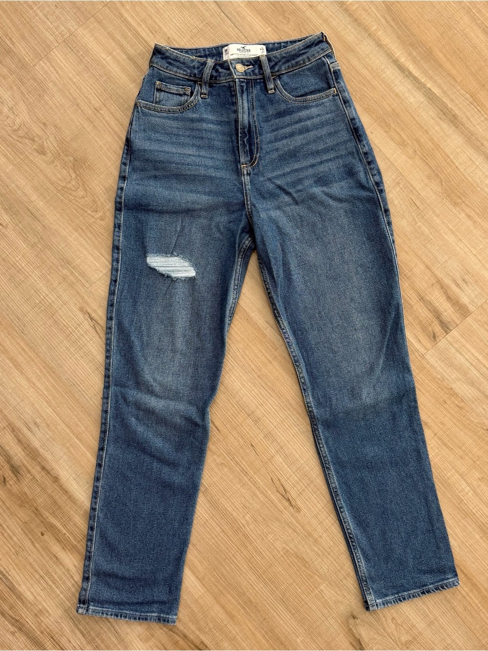 Hollister High-Rise Skinny Jeans in Dark Blue with Distressed Area Above Knee